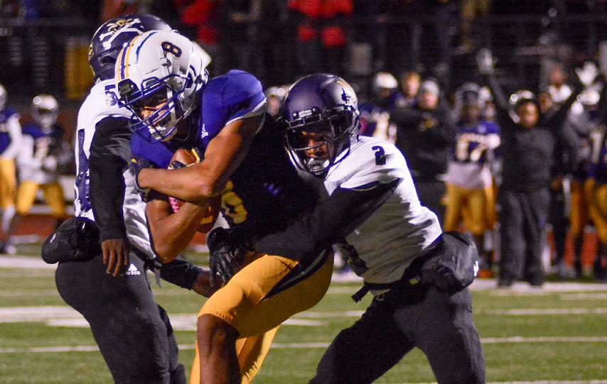 Hickman's wide receiver TJ Turner secures the ball